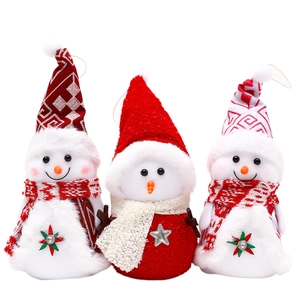 Three plush Christmas snowman figurines with knitted hats and scarves for festive decoration