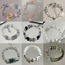 Detailed grid of multicolored beaded bracelets featuring star and moon charms and beads
