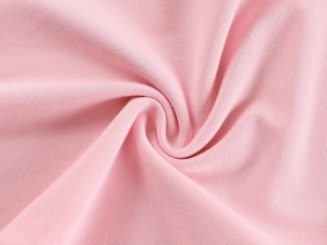 Close-up of soft pink knitted fabric showing delicate texture and fine fiber details