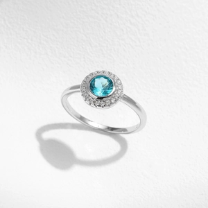 Elegant s925 silver ring featuring a round Paraiba blue gemstone with diamond accents