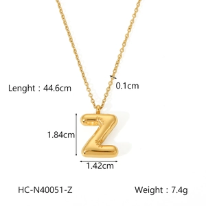 Detail view of golden bubble letter Z pendant with precise dimensions and weight specs