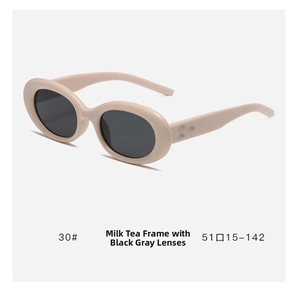 Detail of retro cat-eye oval tea-colored sunglasses frame with dark gray lenses