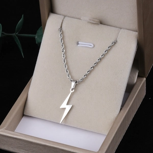 Silver stainless steel lightning bolt pendant necklace on chain in a beige gift jewelry box