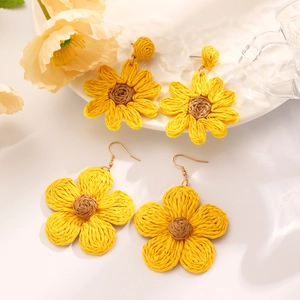 Yellow raffia flower earrings and sunflower studs for a summer beach vacation style