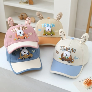 Detail of colorful cartoon baseball caps with 3D bunny ears and embroidered patches