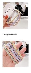 Detailed close-up of colorful braided elastic hair bands with high elasticity and soft texture