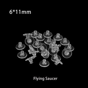 Macro shot of clear silicone flying saucer earring backings sized 6x11mm on black background