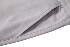 Macro detail of high-quality stitching on the pocket and cotton linen fabric texture