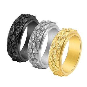 Vintage stainless steel spinner rings for men featuring eye relief pattern in black gold and silver