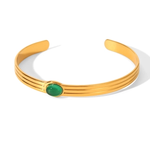 Vintage style gold stainless steel open bangle featuring an oval green natural stone inlay