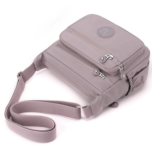 Waterproof light purple nylon crossbody bag with multi-zipper pockets and adjustable strap