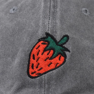 Faded washed cotton baseball cap in grey-black with a detailed strawberry embroidery detail