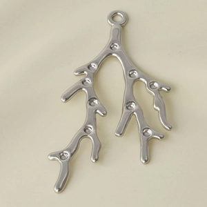 Detailed close-up of a silver 304 stainless steel tree branch pendant for DIY jewelry making