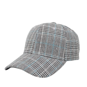 Detail view of the houndstooth baseball cap featuring a retro blue grid pattern