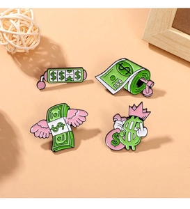 Macro detail of 4-piece set of cartoon dollar pins with flying money and cash machine design