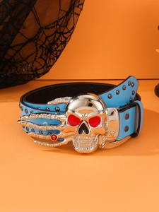 Detail of light blue punk belt with silver skull buckle and red eyes over orange background