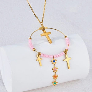 Bohemian gold chain necklace with pink beaded hoop, cross charms, and colorful floral tassels