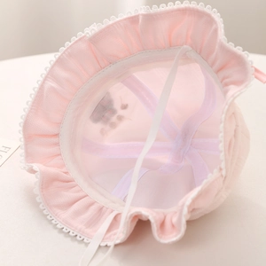 Detail view of pink baby sun hat showing breathable mesh lining and lace edge