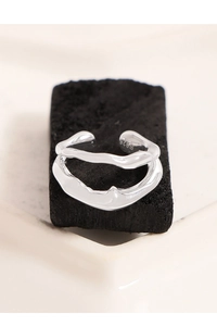 Macro shot of S925 sterling silver double-layer wavy ring on a black charcoal base