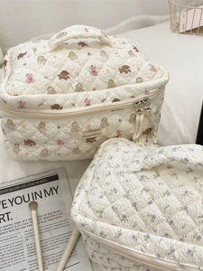 Quilted cartoon makeup bags featuring cute bear and floral prints with carry handles