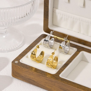 18K gold and silver plated C-shaped earrings with rhinestones in a wooden jewelry box