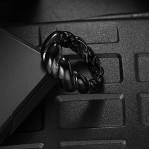 Polished black twisted croissant ring in stainless steel with a sleek mirror finish