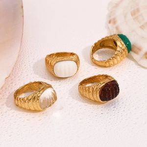Detailed close-up of vintage 18K gold plated stainless steel acrylic rings with water drops