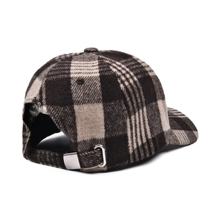 Detail of classic plaid baseball cap with warm wool fabric and adjustable metal buckle