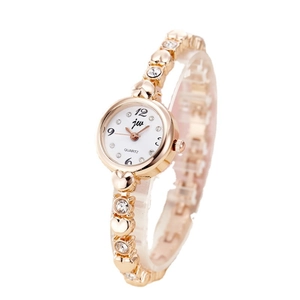 Elegant rose gold women's quartz watch with rhinestone-studded bracelet and white dial