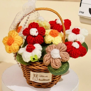 Close-up of handmade crochet flower basket with lace ribbon and pearl pendant detail