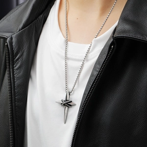 Fashionable men's stainless steel cross pendant necklace with star motif on model