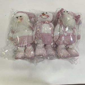 Detailed view of pink sequined plush Christmas gnome, snowman, and reindeer set