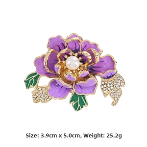 Detail of purple peony brooch featuring enamel petals with white pearl and crystals