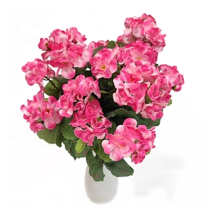 Detail of pink artificial geranium silk flowers in a white ceramic vase for decor