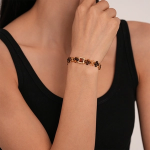 Detailed view of Maillard style faux tiger eye beaded necklace with a zircon square pendant