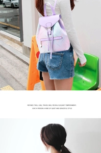 Detail of the gradient pink to purple small faux leather backpack with drawstring closure