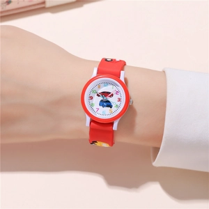 Detailed view of kids cartoon quartz watch with red silicone strap and race car pattern dial