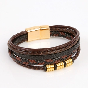 Detail of multi-layer woven leather bracelet with golden magnetic clasp and beads