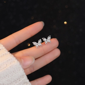 Elegant S999 sterling silver butterfly stud earrings with sparkling clear zircon accents
