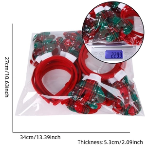 Macro view showing packaging dimensions 34x27cm and weight for Christmas headbands