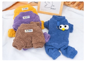 Detail of warm pet fleece jumpsuits with metal D-rings and cute cartoon eyes in four colors