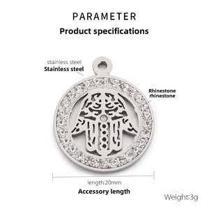 Detailed view of silver stainless steel Hamsa hand pendant with rhinestone circle
