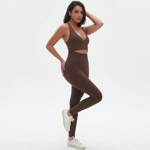 Detailed side view of seamless dark brown cross-back sports bra and high waist yoga leggings