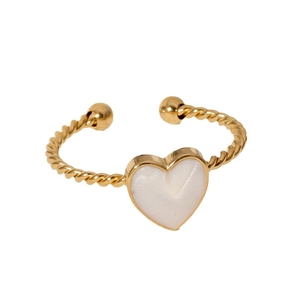 Minimalist gold heart ring featuring a twisted band and white enamel heart center