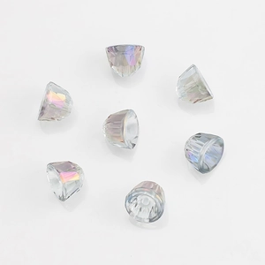 Macro detail of seven faceted iridescent glass bell pendants for DIY jewelry making