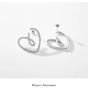 Detail of S925 sterling silver heart earrings with pavé micro-set cubic zirconia crystals