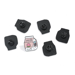 Cute pink peach milk carton enamel pins with black rubber clutch backs on white background