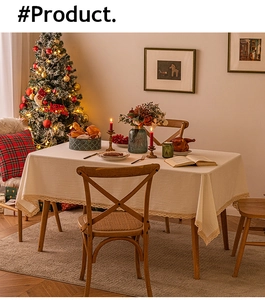 Close-up of beige table cloth with elegant lace edges and festive holiday setting