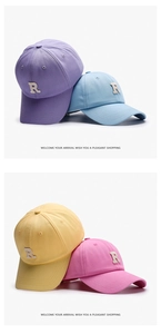 Detail of Letter R embroidery on breathable cotton baseball caps in multiple colors