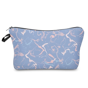 Detail view of marble texture blue makeup bag with zipper closure and side hanging loop